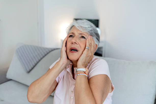 istock Exhausted mature lady suffering from head ache at home. 1333198399