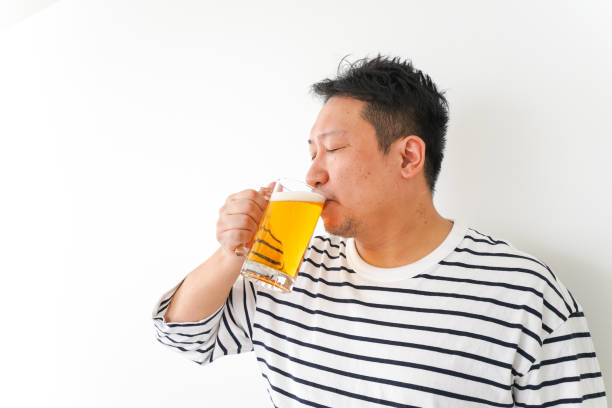 istock Middle-aged man drinking beer at home 1333202283
