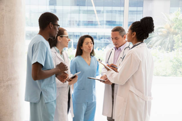 istock Medical staff talking at hallway 1333202413
