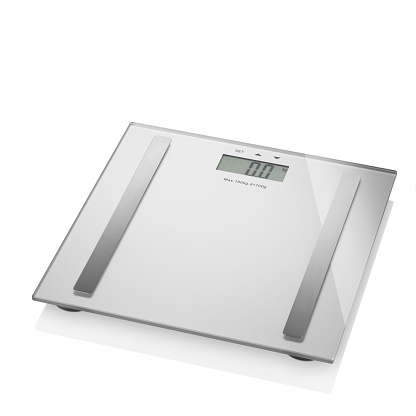 Silver tempered glass digital bathroom scale isolated