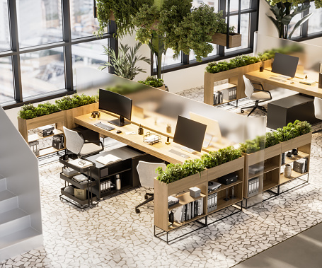 3d render of modern office and working space. High angle view of coworking space with computers and plants on desk.