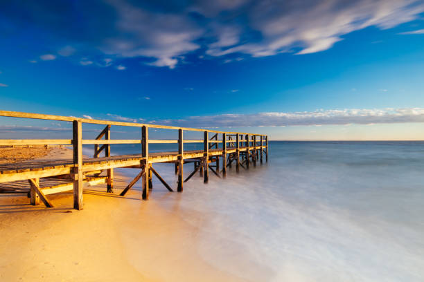 Piers near Millionaire's Walk at Point King Beach on a cool winter's morning at sunrise on the Mornington Peninsula in Sorrento, Victoria, Australia