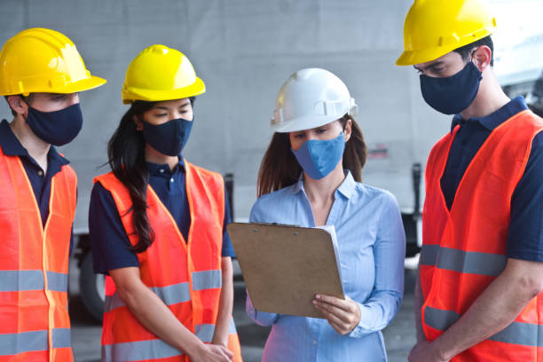 istock Warehouse employees talking to the boss 1333208182