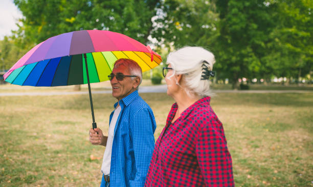 istock Couple walking in wet day 1333210196
