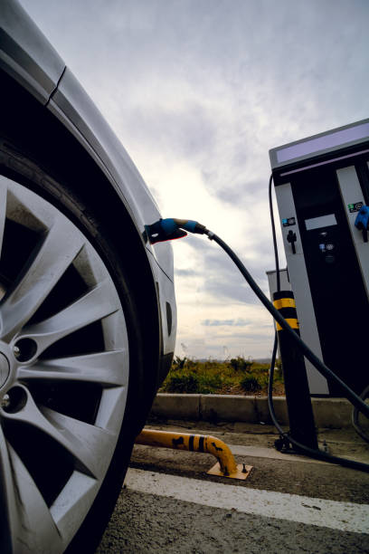 istock Electric car fast charging near the EV charging station 1333214103