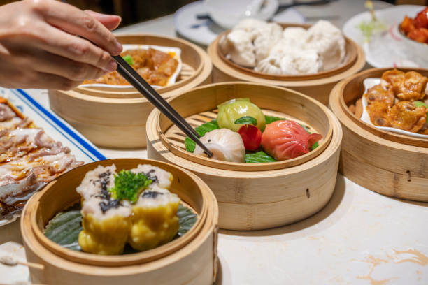 istock People eating Guangdong dum sum with chopsticks 1333220822