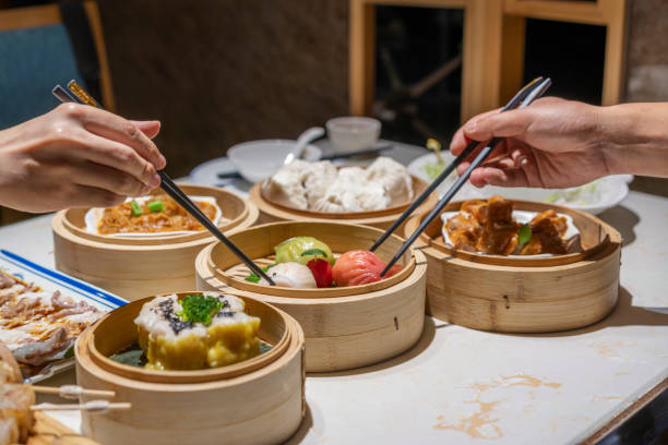 istock People eating Guangdong dum sum with chopsticks 1333222041