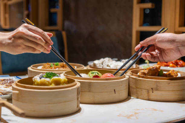 istock People eating Guangdong dum sum with chopsticks 1333222049