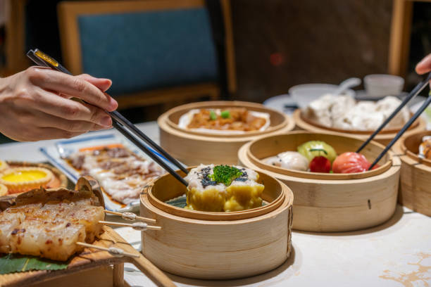 istock People eating Guangdong dum sum with chopsticks 1333222068
