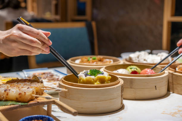 istock People eating Guangdong dum sum with chopsticks 1333222367