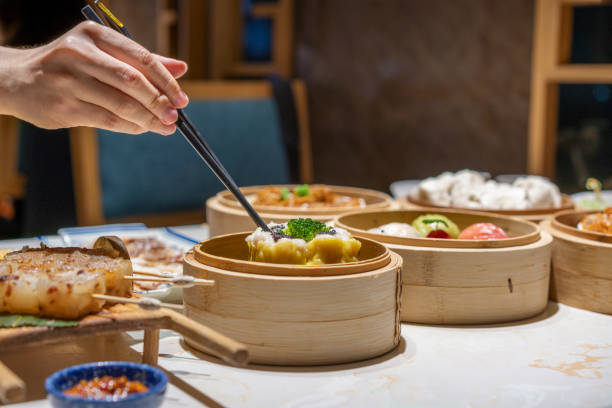 istock People eating Guangdong dum sum with chopsticks 1333222371