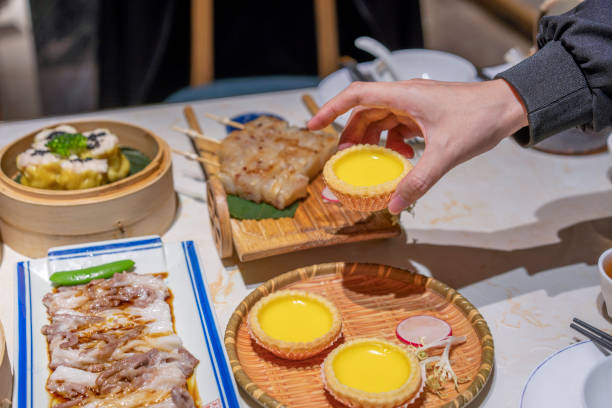 istock People eating Guangdong dum sum Egg Tart 1333223765