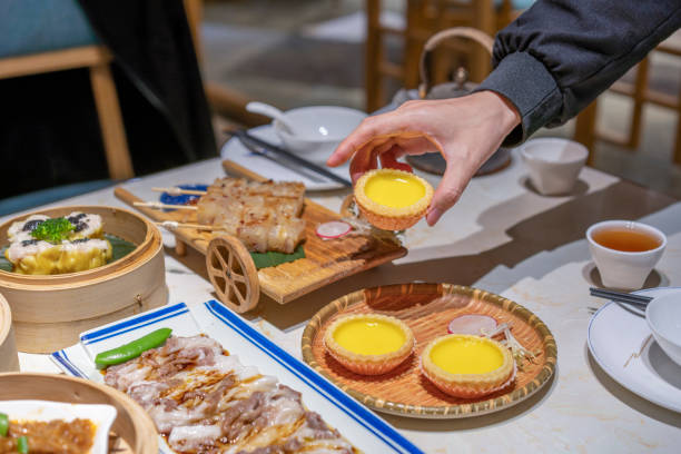 istock People eating Guangdong dum sum Egg Tart 1333223796