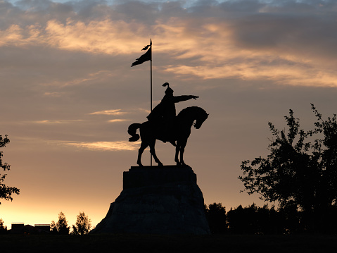 Russia, Tatarstan, Elabuga. Monument to the Bulgarian Khan Ibrahim I ben Mukhamad. Silhouette, beautiful sky at sunset.