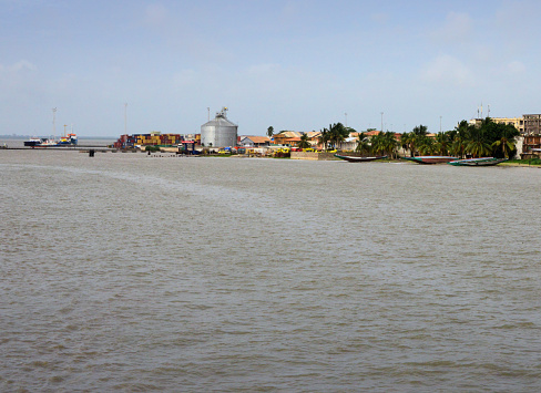 Banjul, The Gambia: Gambia River estuary - harbour, ferry terminal and fishing boats seen from the Atlantic Ocean.