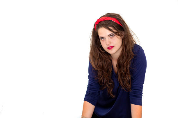 A young woman with a red hat is waiting for a guy, a specific treatment of color