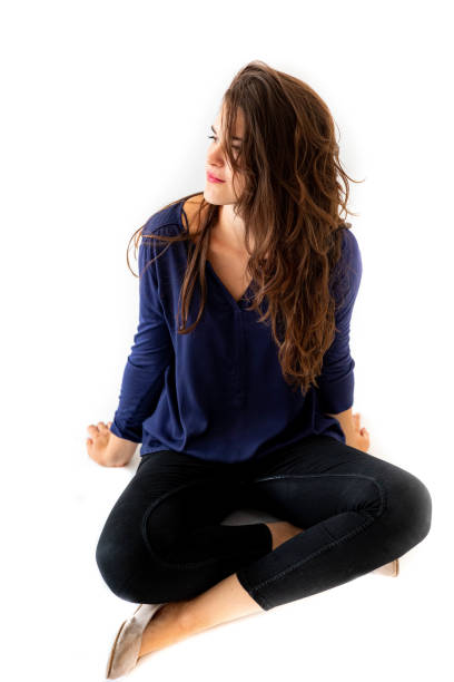 istock Young women sitting on the white background 1333227658