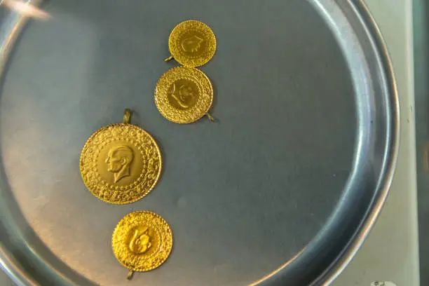 Photo of Gram gold coins weighed on precision scales