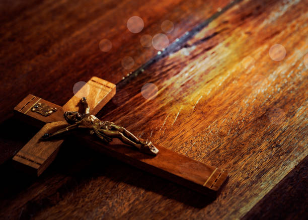 Jesus's crucifix  on wooden table background stock photo
