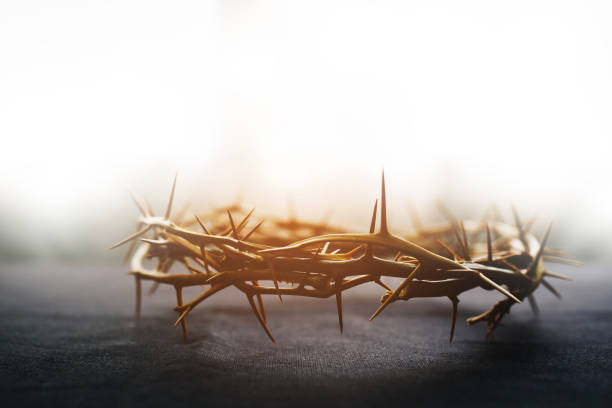 the crown of thorns of Jesus on  black background against  window light with copy space the crown of thorns of Jesus on  black background against  window light with copy space, can be used for Christian background, Easter concept the crucifixion photos stock pictures, royalty-free photos & images