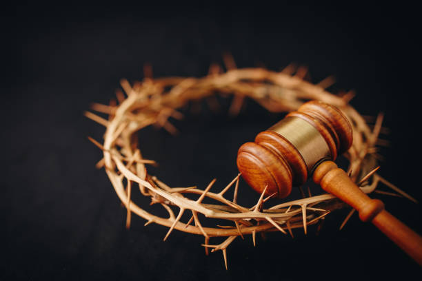 crown of thorns of Jesus and  Judge gavel on  black background. Christian back concept show God justice and Christ's redemption  concept stock photo
