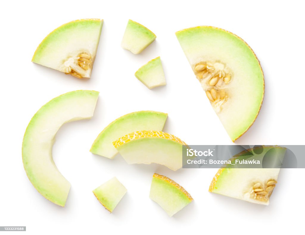 Galia Melon Pieces Isolated On White Background Galia melon pieces isolated on white background. View from above, flat lay Melon Stock Photo