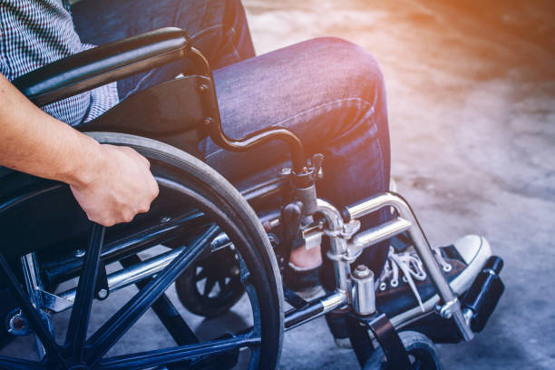istock Paralyzed man using his wheelchair, sepia tone 1333238909