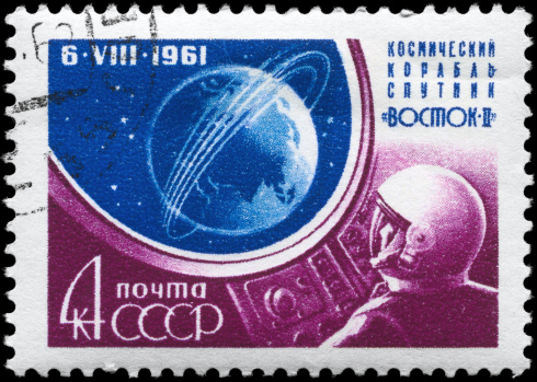 A Stamp printed in USSR shows the Globe with Orbit and Cosmonaut, series, circa 1961