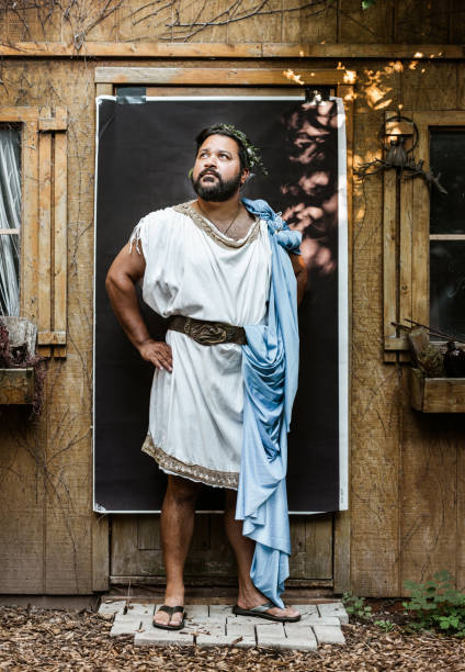 bts portrait of mature actor against backdrop - toga stockfoto's en -beelden