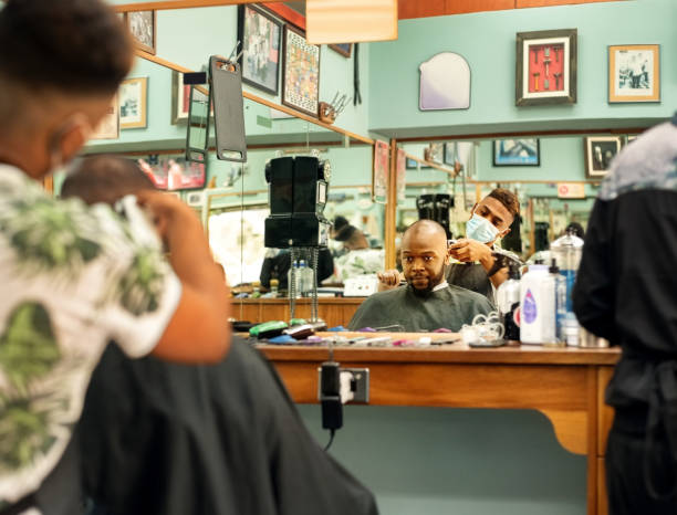 Man getting haircut in the salon stock photo