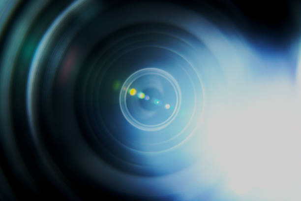 Photo of the inside of a camera lens with light leaks and a flare. Shot naturally.