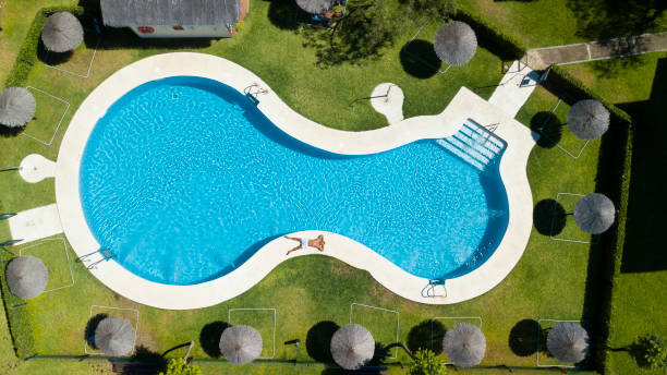 istock young man relaxing at swimming pool 1333243712