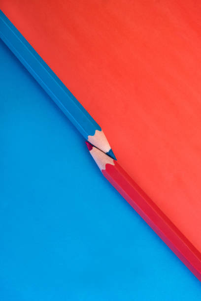 istock Two vibrant pink and blue colored pencils 1333243818