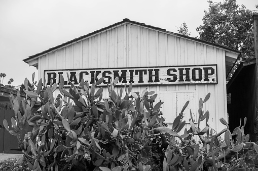 Black and white photo of a historic blacksmith shop in Old Town San Diego