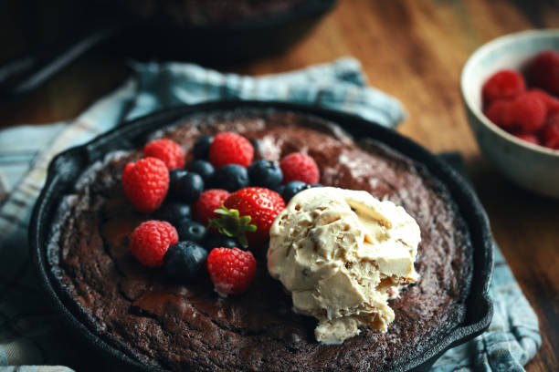 istock Cast Iron Chocolate Brownies with Berries and Ice Cream 1333244596