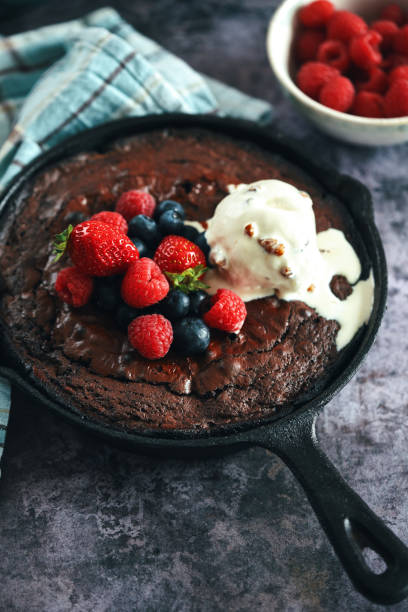 istock Cast Iron Chocolate Brownies with Berries and Ice Cream 1333244748