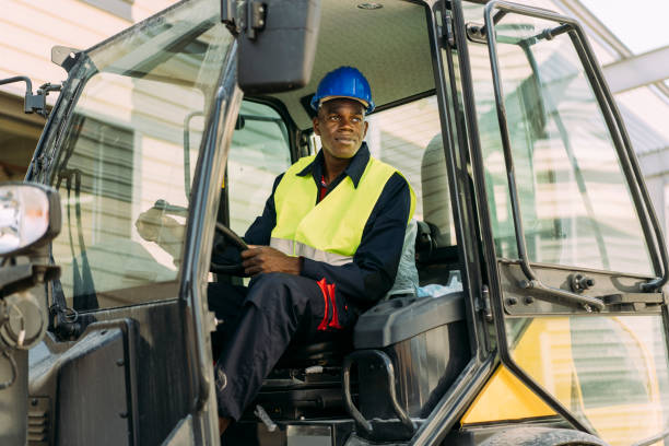 istock Afro-American excavator driver sitting in his machine 1333248227