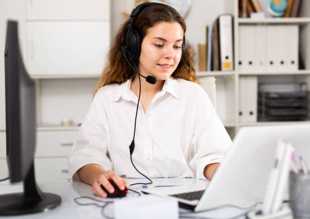 istock Young positive woman customer support phone operator 1333248994