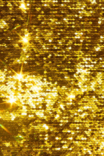 istock Gold glittering sequins sequins scales, background for your design 1333249024