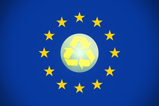 European flag with the recycle logo in the center.Concept of recycling in Europe.