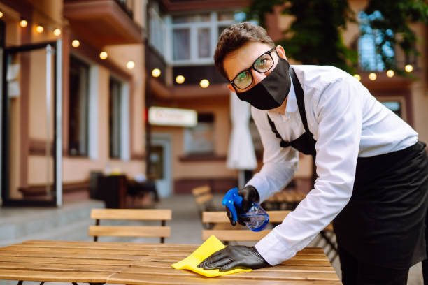 istock Disinfecting cafe tables to prevent COVID-19. 1333253746