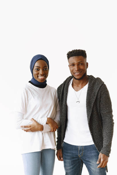 istock Young african couple standing on white background 1333256052