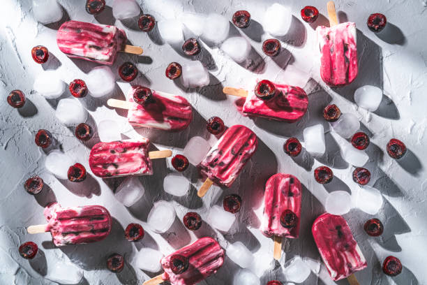 istock Cherry fruit popsicles homemade with yogurt ice cream melting on white 1333258141