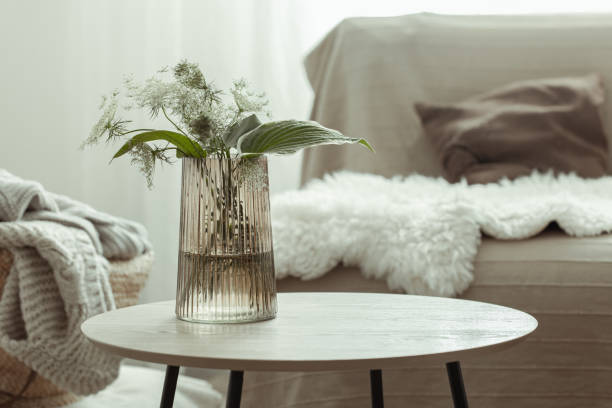 istock Glass vase with plants in a Scandinavian home interior. 1333259199