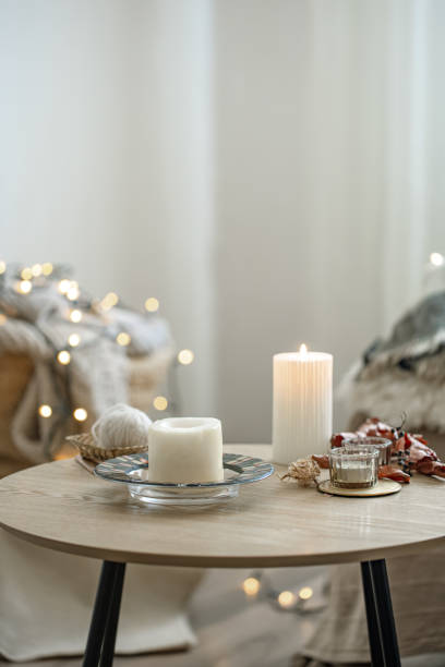 istock Cozy home composition with candles on blurred bokeh background. 1333259208