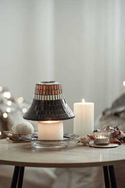 istock Cozy composition with burning candles on a blurred background with bokeh. 1333259210
