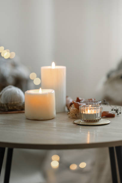 istock Cozy home composition with candles on blurred bokeh background. 1333259214