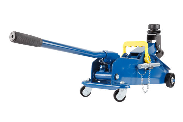 istock blue hydraulic car jack isolated on white background, half rised 1333259321