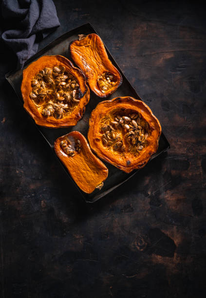 istock Pumpkin and butternut squash roasted oven on dark wooden background 1333260087