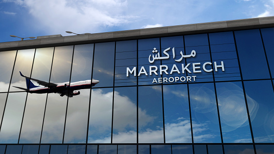 Aircraft landing at Marrakesh, Marrakech, Morocco 3D rendering illustration. Arrival in the city with the glass airport terminal and reflection of jet plane. Travel, business, tourism and transport.